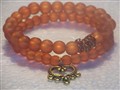 orange glas armband 2  med berlock.jpg